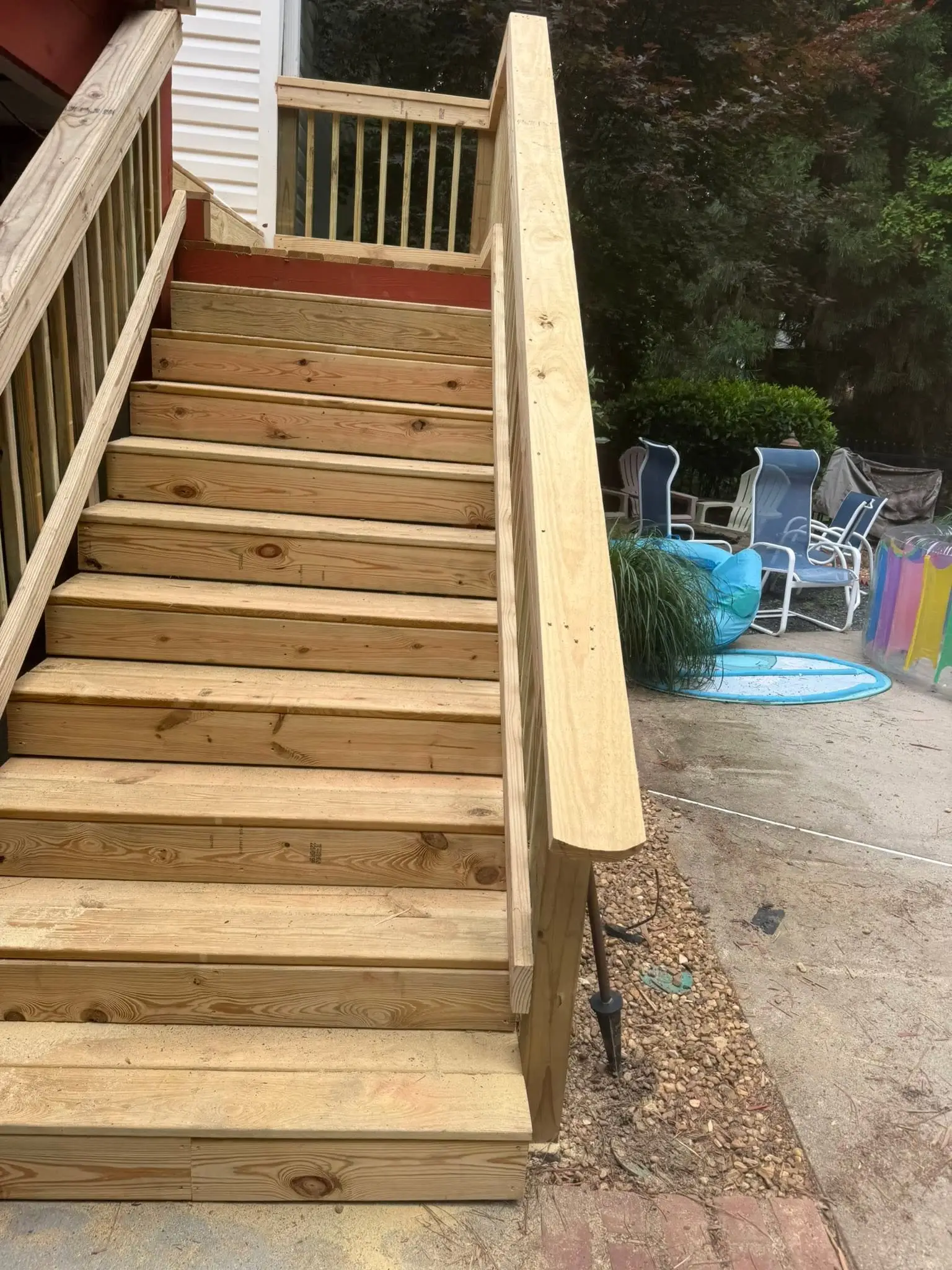New deck boards, handrails, and post lights before staining
