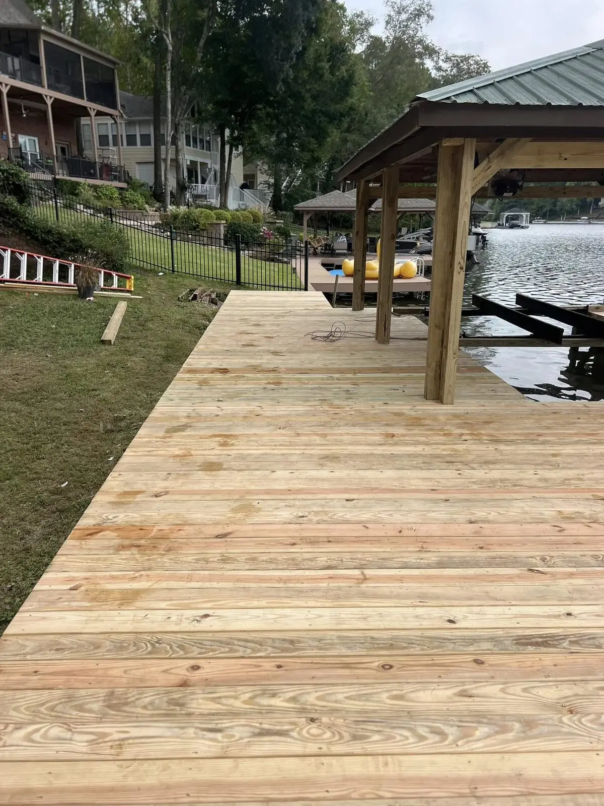New pressure-treated dock decking and covered slip going in at Fairfield Plantation