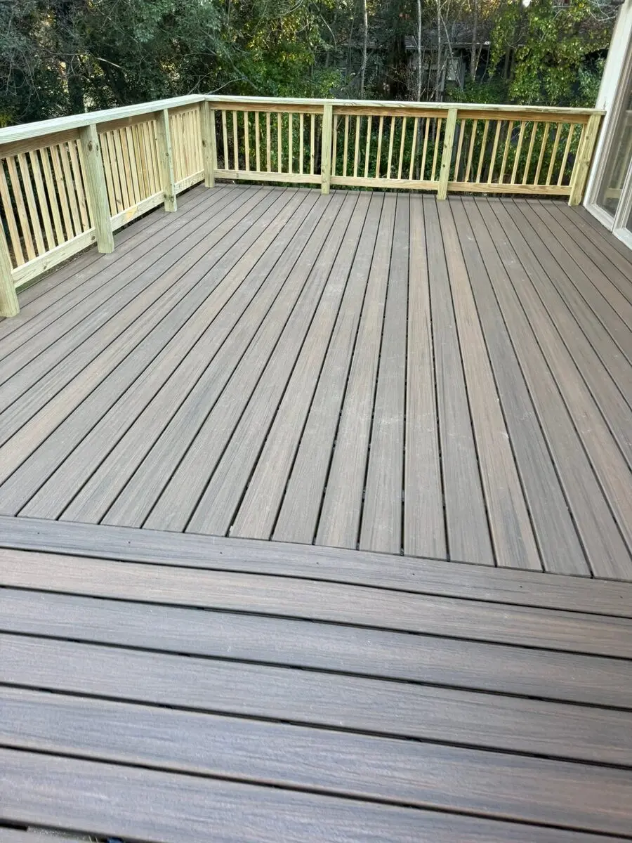 Completed composite-floor deck rebuild with new pressure-treated rails