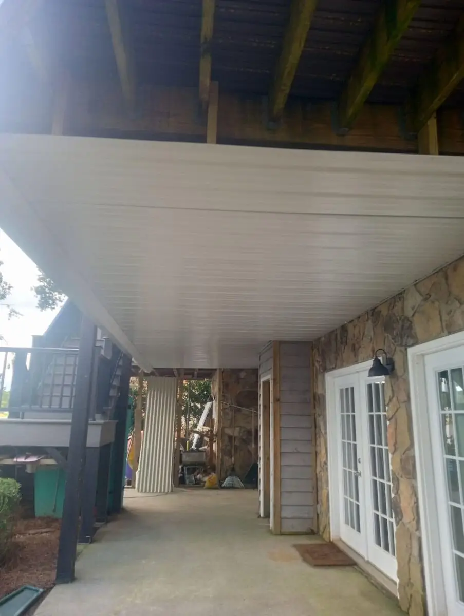 White beadboard ceiling underside of a covered deck/porch during construction
